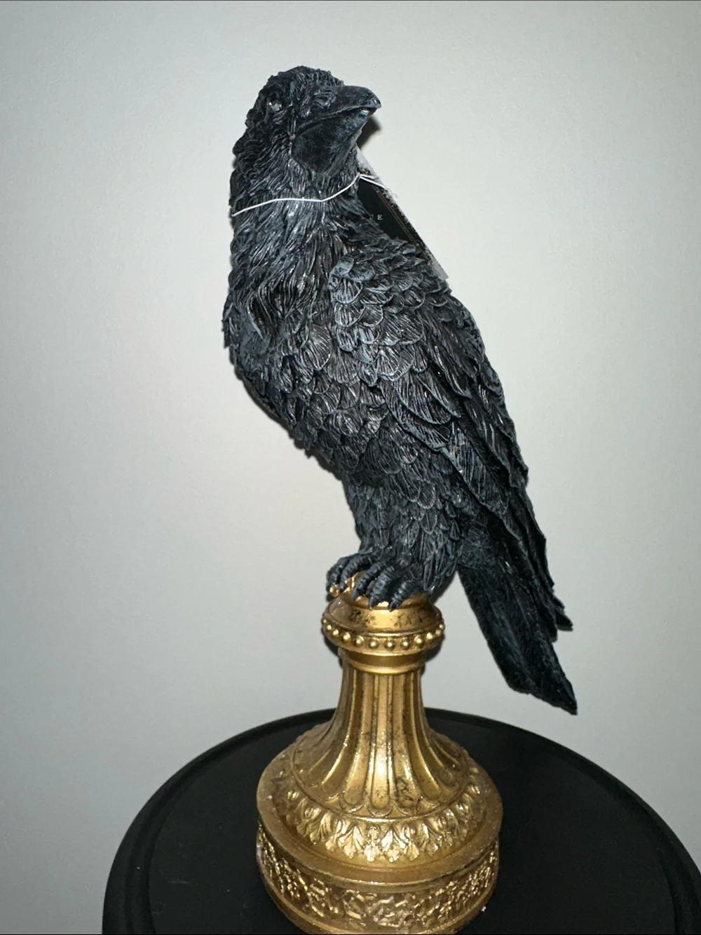 Black Decorative Raven Statue on Gold Pedestal - crow